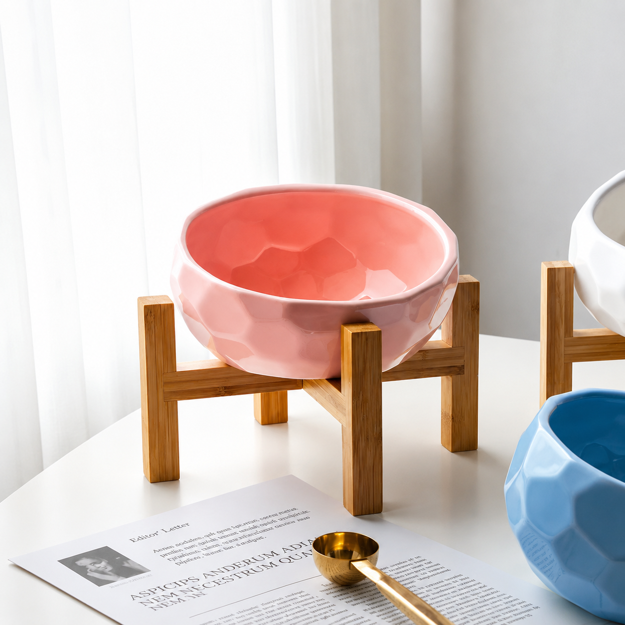 Pink elevated ceramic pet feeding bowl with natural bamboo stand for comfortable feeding