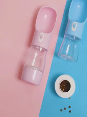 Blue pet water bottle displayed in a lifestyle setting for outdoor travel use.